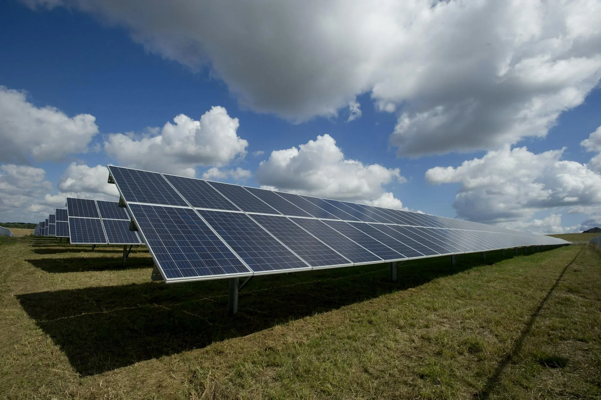 Solar panel array under a dramatic sky